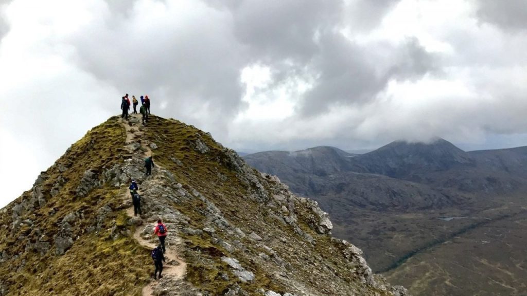 323337 tourists at the peak of a mountain