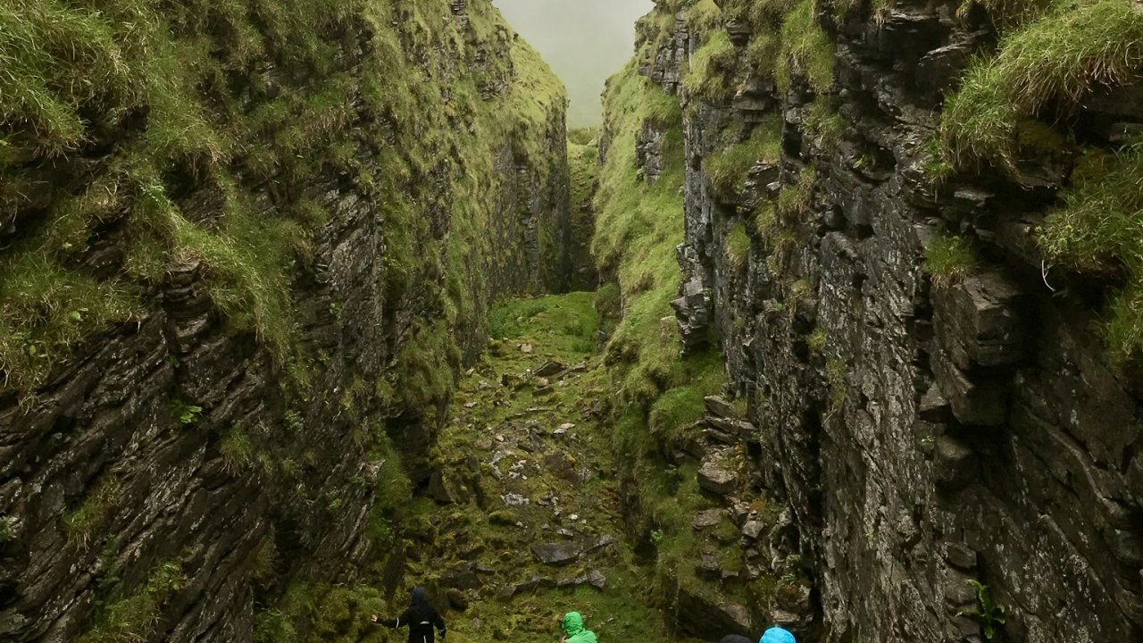 view of grassy mountain rocks